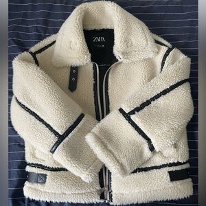 Beige faux fur biker jacket from Zara. It’s an XS but is a very loose fit.